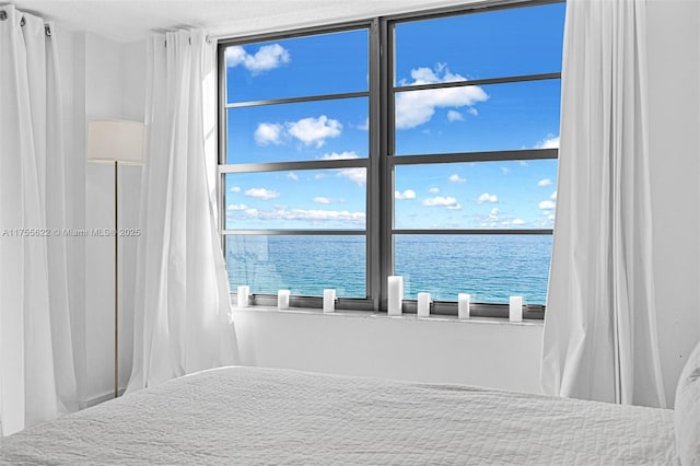 unfurnished bedroom with a water view