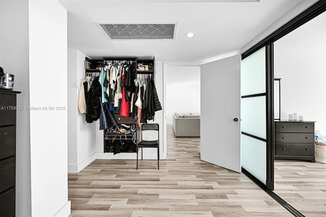 walk in closet with visible vents and light wood-style flooring