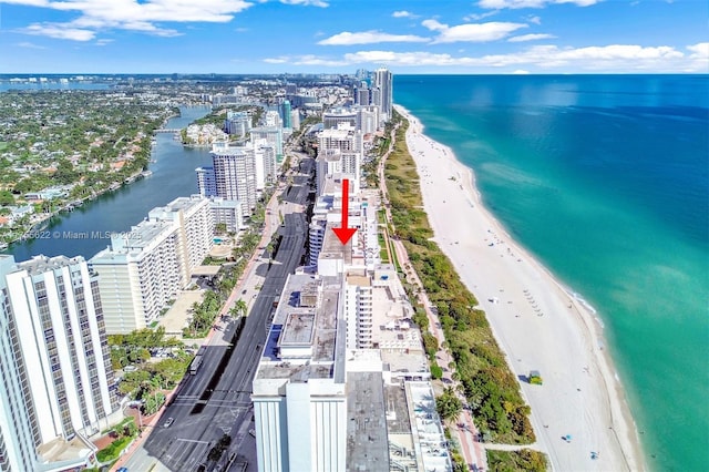 bird's eye view with a view of the beach, a view of city, and a water view
