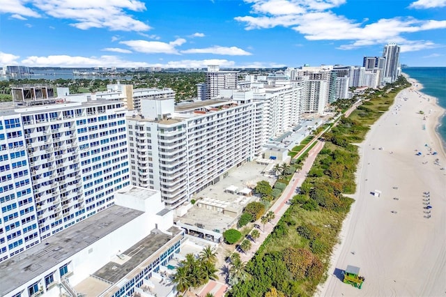 aerial view with a city view, a beach view, and a water view