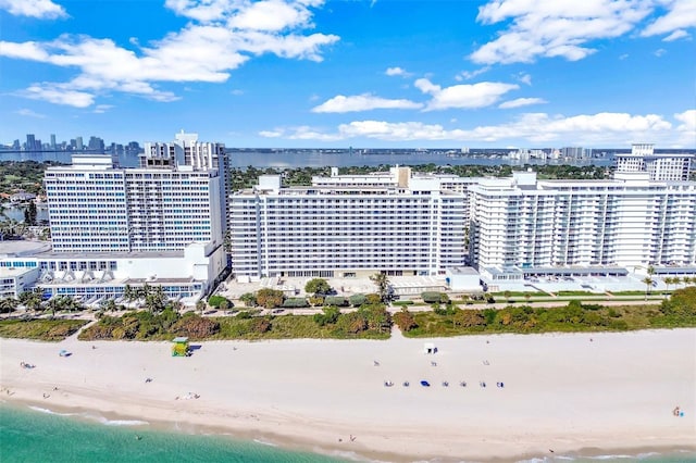 aerial view featuring a view of city, a view of the beach, and a water view