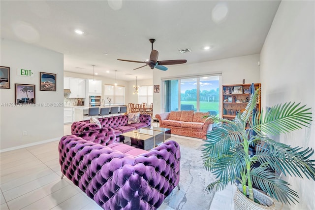 living area with light tile patterned floors, baseboards, visible vents, a ceiling fan, and recessed lighting