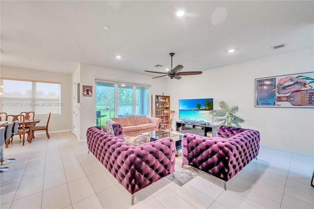 tiled living area featuring a ceiling fan, recessed lighting, visible vents, and baseboards