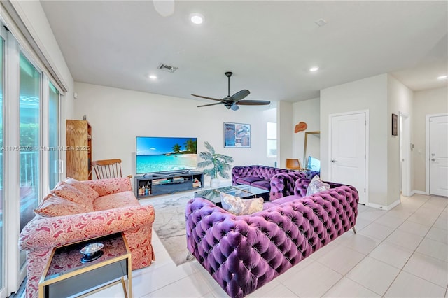 living room featuring light tile patterned floors, a ceiling fan, visible vents, and recessed lighting