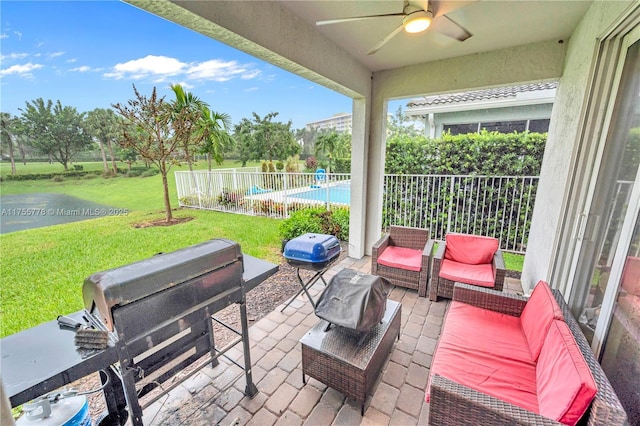 view of patio / terrace featuring ceiling fan, outdoor lounge area, fence, area for grilling, and a fenced in pool