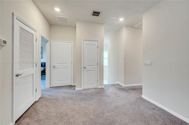 interior space with recessed lighting, visible vents, and baseboards