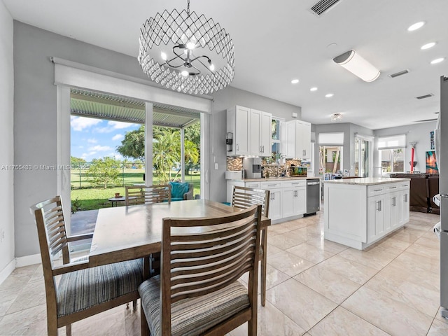 dining room with baseboards, visible vents, and recessed lighting