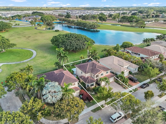 bird's eye view featuring a water view and a residential view