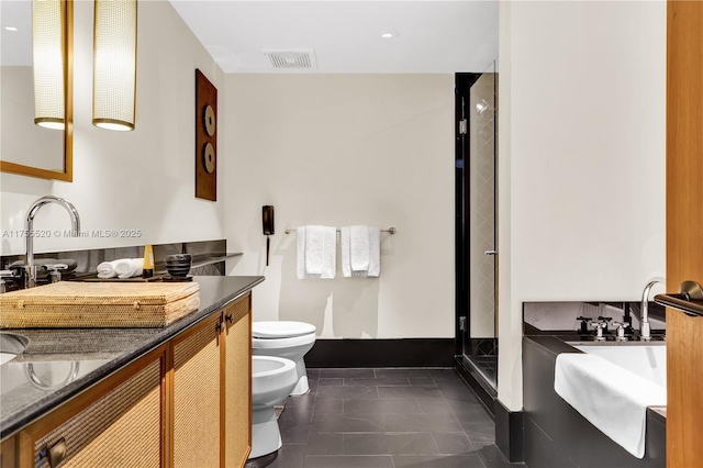 bathroom featuring tile patterned flooring, toilet, vanity, visible vents, and a bidet