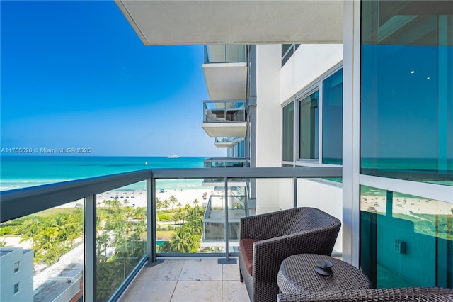 balcony featuring a water view