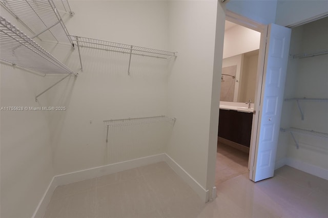 spacious closet with a sink