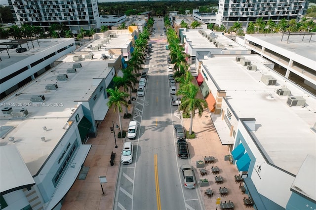 birds eye view of property featuring a city view