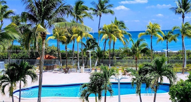 2655 Collins Ave Unit 1505, Miami Beach, FL 33140 - community pool featuring a patio and a water view