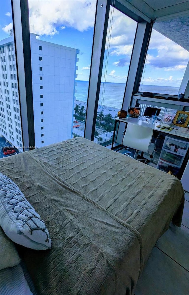 bedroom featuring a water view