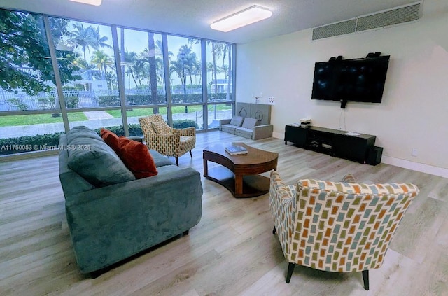 2655 Collins Ave Unit 1505, Miami Beach, FL 33140 - living area featuring expansive windows and wood finished floors