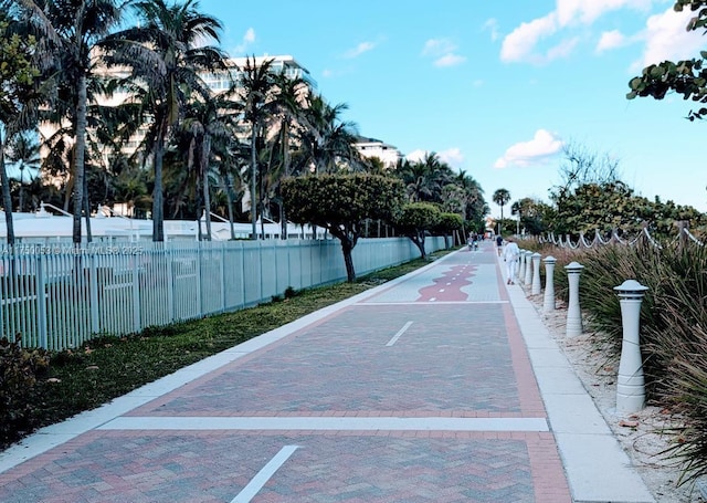 view of property's community featuring fence