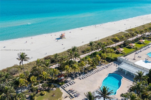 2655 Collins Ave Unit 1505, Miami Beach, FL 33140 - drone / aerial view of waterfront with a beach and a pool