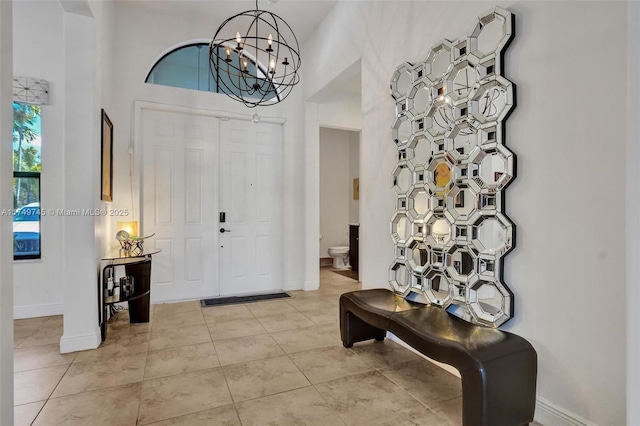 4455 Parkside Rd, Davie, FL 33328 - foyer entrance with a chandelier, a high ceiling, and light tile patterned floors