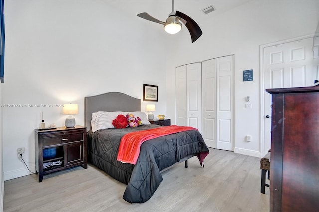 4455 Parkside Rd, Davie, FL 33328 - bedroom with light wood-style flooring, a closet, a ceiling fan, and a high ceiling