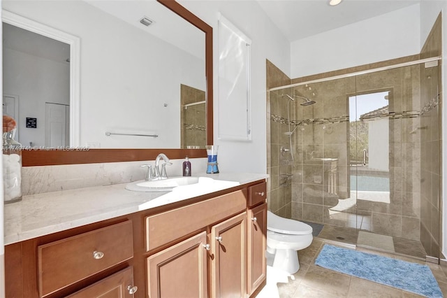 full bathroom featuring visible vents, toilet, a shower stall, vanity, and tile patterned floors