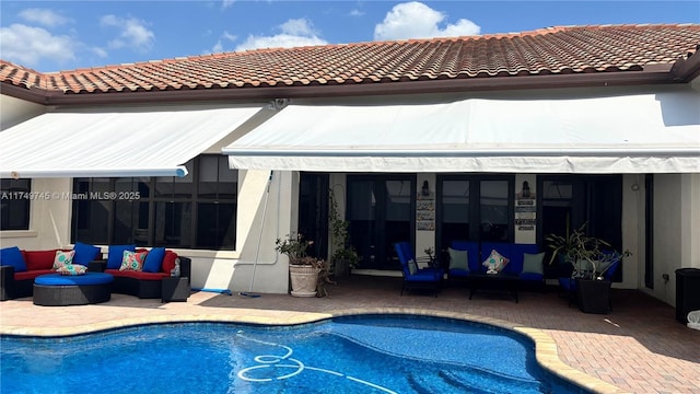 4455 Parkside Rd, Davie, FL 33328 - back of house featuring an outdoor hangout area, a patio area, and an outdoor pool