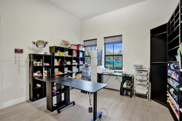 office featuring baseboards and wood finished floors