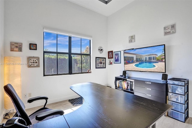 4455 Parkside Rd, Davie, FL 33328 - home office with light wood finished floors and a towering ceiling