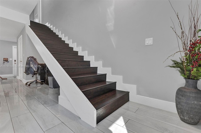 stairway with baseboards