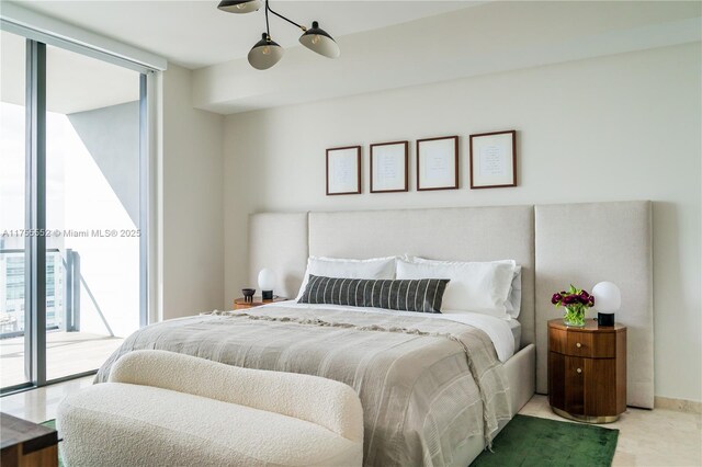 bedroom with access to outside and expansive windows