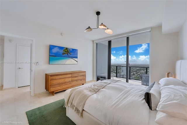 bedroom featuring floor to ceiling windows