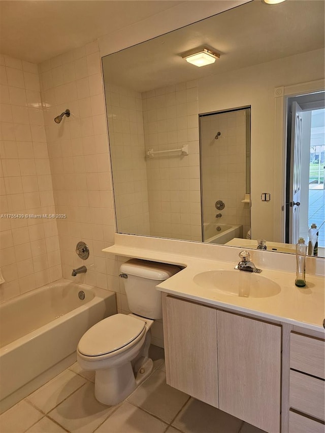 full bath with bathing tub / shower combination, vanity, toilet, and tile patterned floors