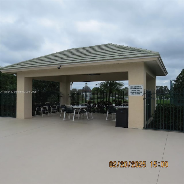 view of patio / terrace featuring fence and a gazebo