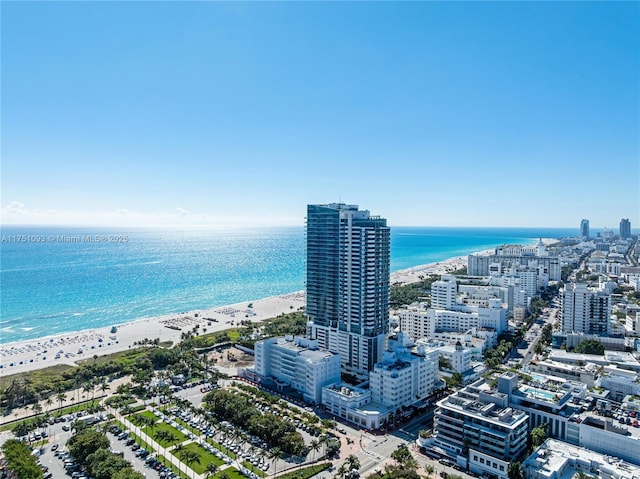 bird's eye view featuring a view of city, a beach view, and a water view