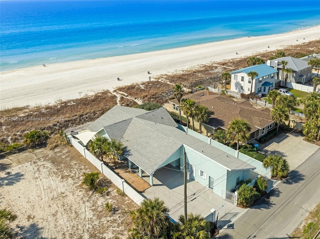 bird's eye view featuring a residential view, a water view, and a beach view