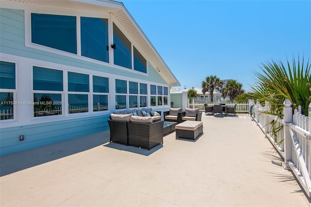 view of patio / terrace featuring fence and an outdoor living space