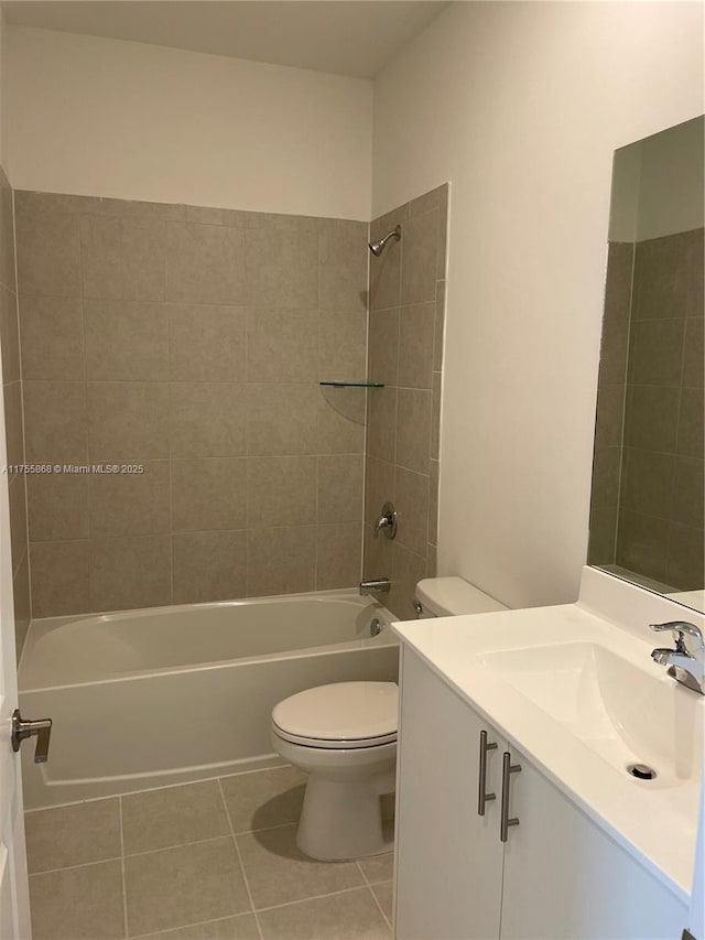 full bath featuring vanity, shower / washtub combination, tile patterned flooring, and toilet