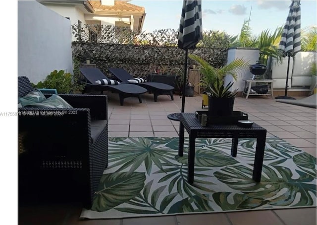 view of patio / terrace featuring fence and an outdoor living space