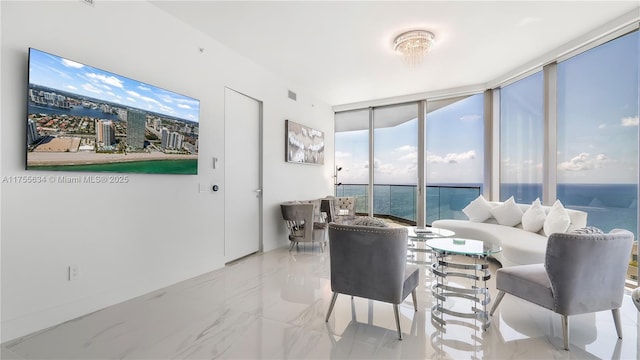 18975 Collins Ave Unit 3504, Sunny Isles Beach, FL 33160 - living room with expansive windows, a water view, and marble finish floors