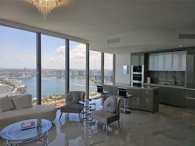 18975 Collins Ave Unit 3504, Sunny Isles Beach, FL 33160 - living room featuring a water view, a wall of windows, and light marble finish flooring