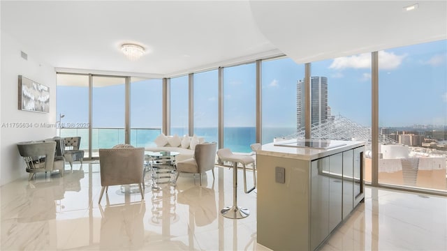 18975 Collins Ave Unit 3504, Sunny Isles Beach, FL 33160 - kitchen with a wall of windows, a water view, and electric cooktop