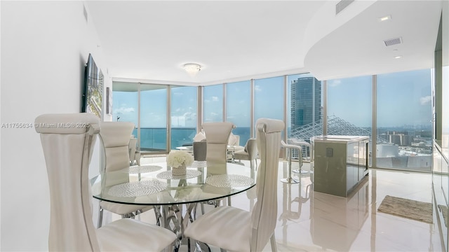 18975 Collins Ave Unit 3504, Sunny Isles Beach, FL 33160 - tiled dining space featuring a wall of windows and plenty of natural light