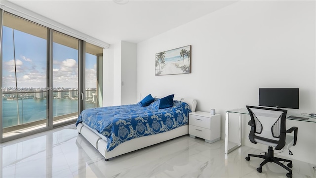18975 Collins Ave Unit 3504, Sunny Isles Beach, FL 33160 - bedroom featuring access to exterior, light marble finish flooring, an office area, and a wall of windows