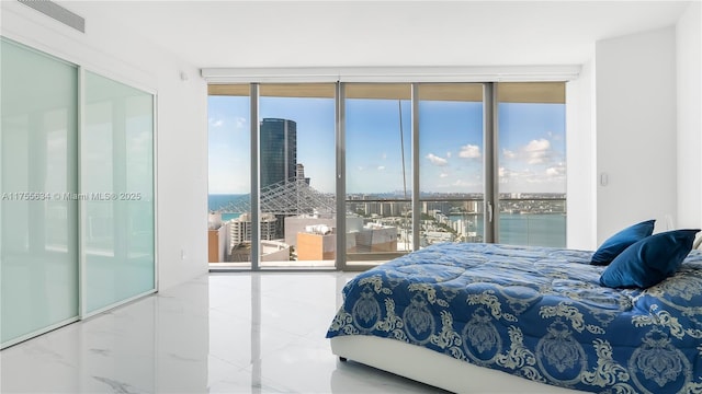 18975 Collins Ave Unit 3504, Sunny Isles Beach, FL 33160 - bedroom featuring access to exterior, multiple windows, and a water view