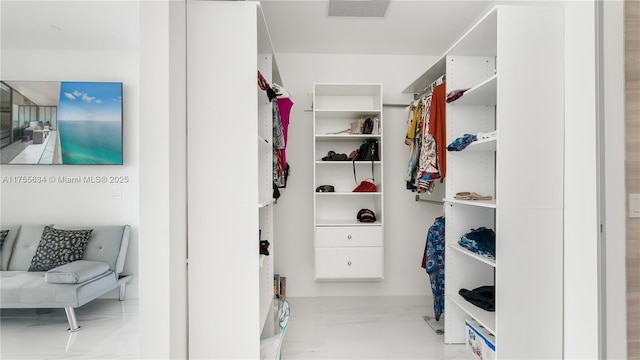18975 Collins Ave Unit 3504, Sunny Isles Beach, FL 33160 - walk in closet featuring marble look tile flooring