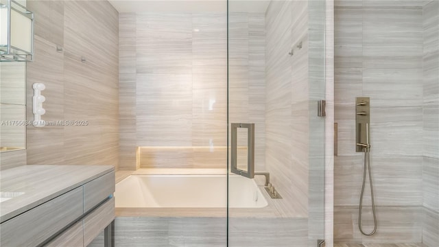 18975 Collins Ave Unit 3504, Sunny Isles Beach, FL 33160 - full bath with a bath, a stall shower, vanity, and tile walls