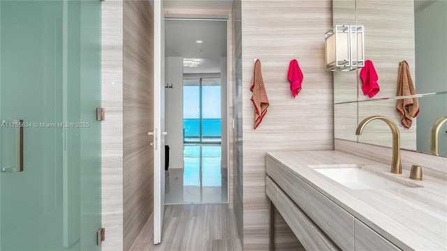 18975 Collins Ave Unit 3504, Sunny Isles Beach, FL 33160 - bathroom featuring tile walls and vanity