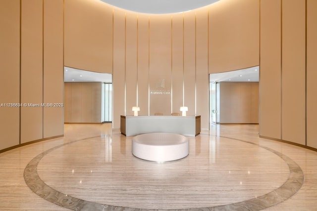 18975 Collins Ave Unit 3504, Sunny Isles Beach, FL 33160 - reception area featuring a towering ceiling and a decorative wall