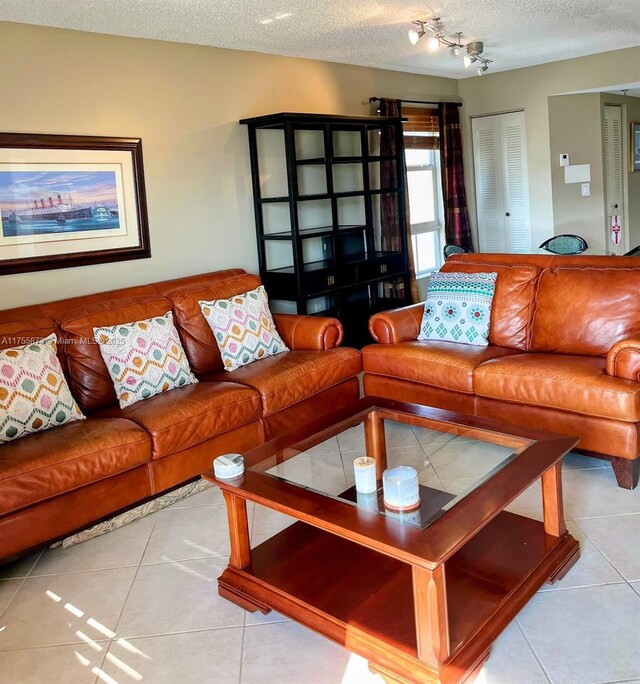 2351 Douglas Rd Unit 1109, Miami, FL 33145 - living area featuring tile patterned floors and a textured ceiling