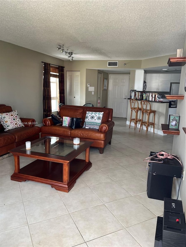 2351 Douglas Rd Unit 1109, Miami, FL 33145 - living room with a textured ceiling and light tile patterned floors