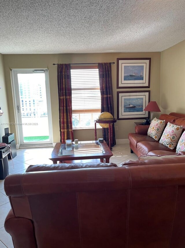 2351 Douglas Rd Unit 1109, Miami, FL 33145 - living area featuring light tile patterned flooring and a textured ceiling